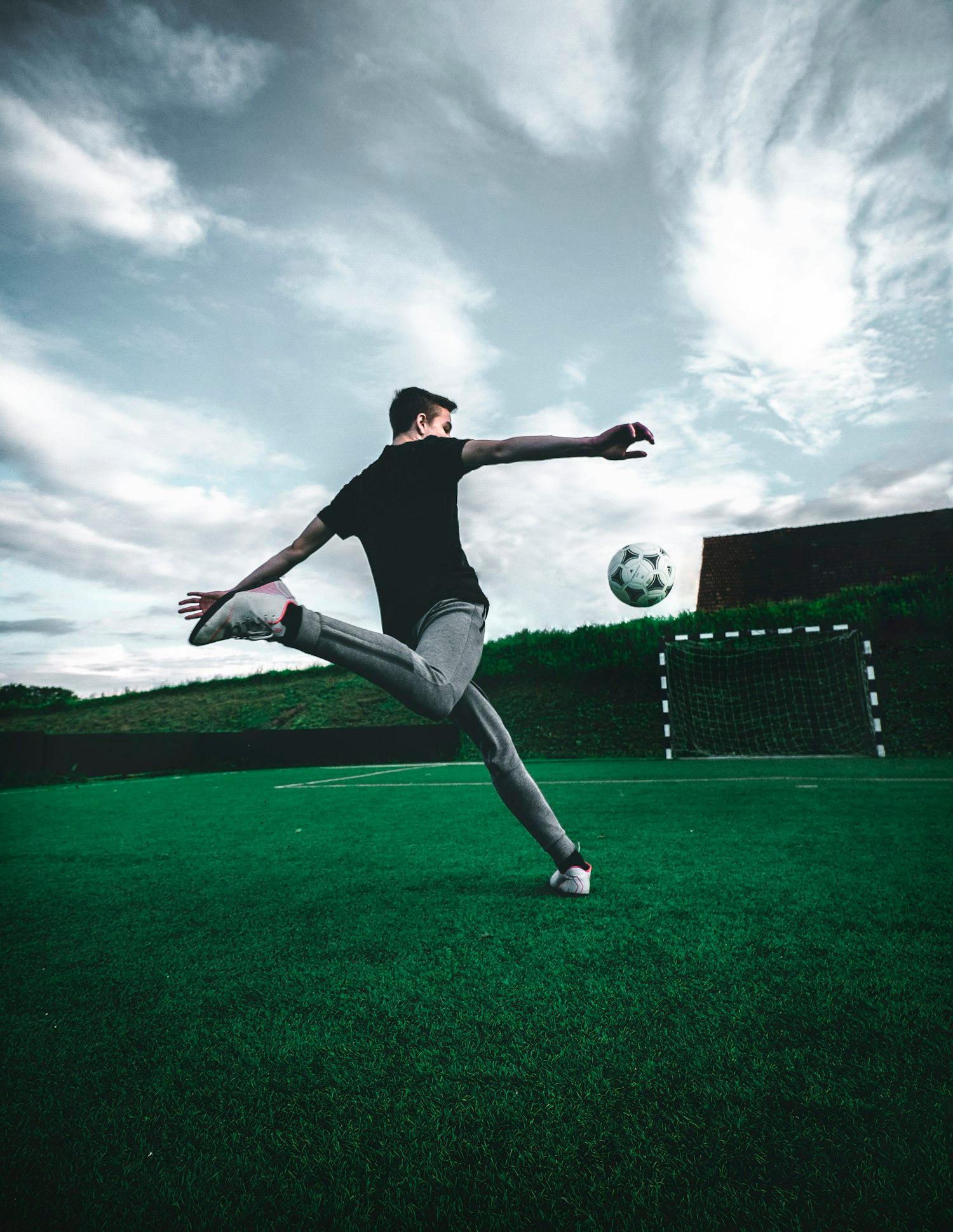 Soccer player striking the ball